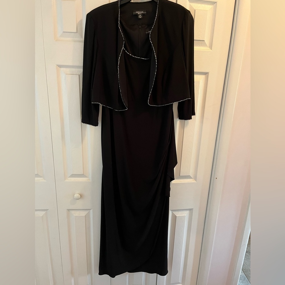 Elegant long dress with short jacket for fancy occasions.